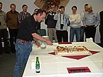 Paul Beach in cutting the cake